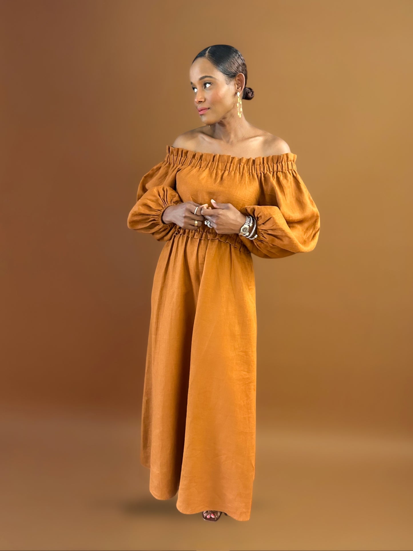 Solenna-romantic-off-the-shoulder-linen-maxi-dress-shown-in-Sienna-brown-rust-color